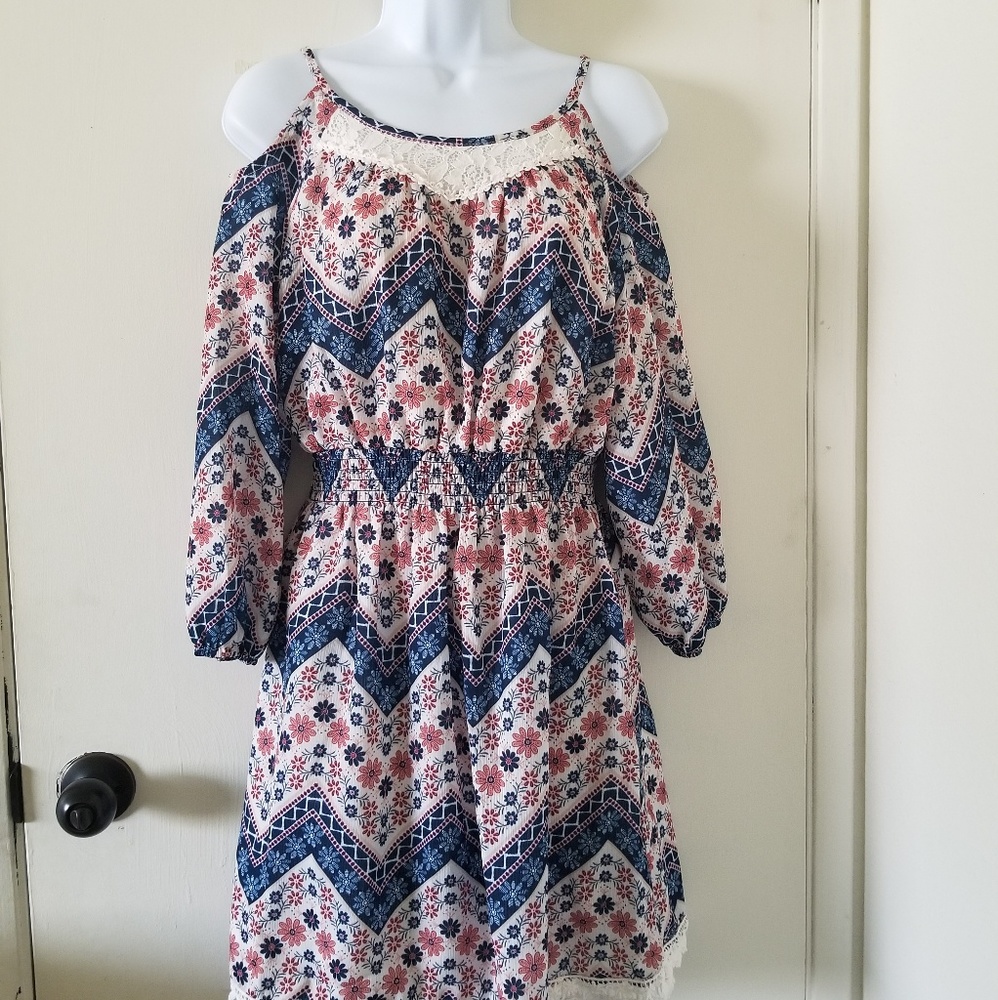 Long sleeve dress with lace on it.